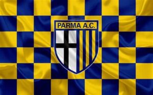 Logo del Parma Calcio su sfondo giallo: scudo diviso in due parti, a sinistra croce nera su campo bianco, a destra strisce verticali gialle e blu.